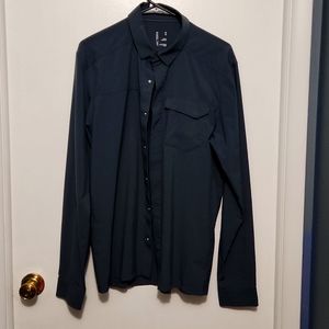 Medium size, button down, long sleeve Arc'teryx shirt with logo behind neck.